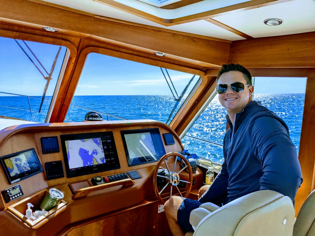 Captain Drew at the helm of the Grady White Canyon 336